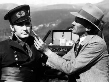 1927 Makeup artist Jack Dawn trimming the sideburns of the actor Tim McCoy