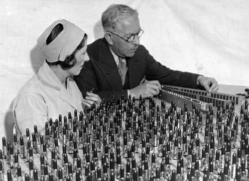 1932 Max Factor and Ray Judd examining lipsticks