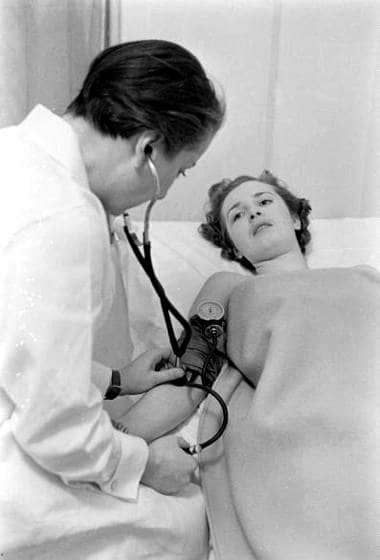 1937 Client having her blood pressure measured