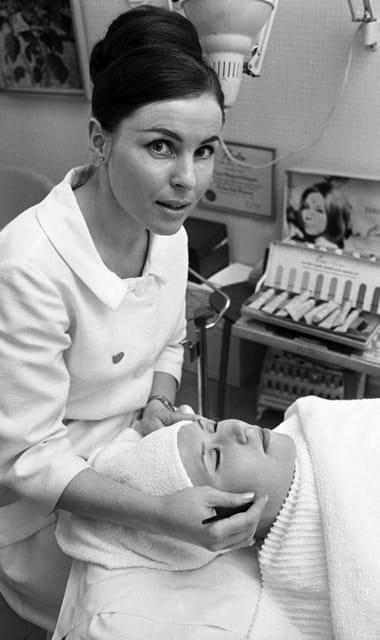 1966 Therapist conducting a facial in a salon