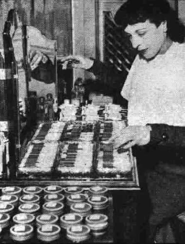 1937 Actress sampling make-up in Regent Street, London